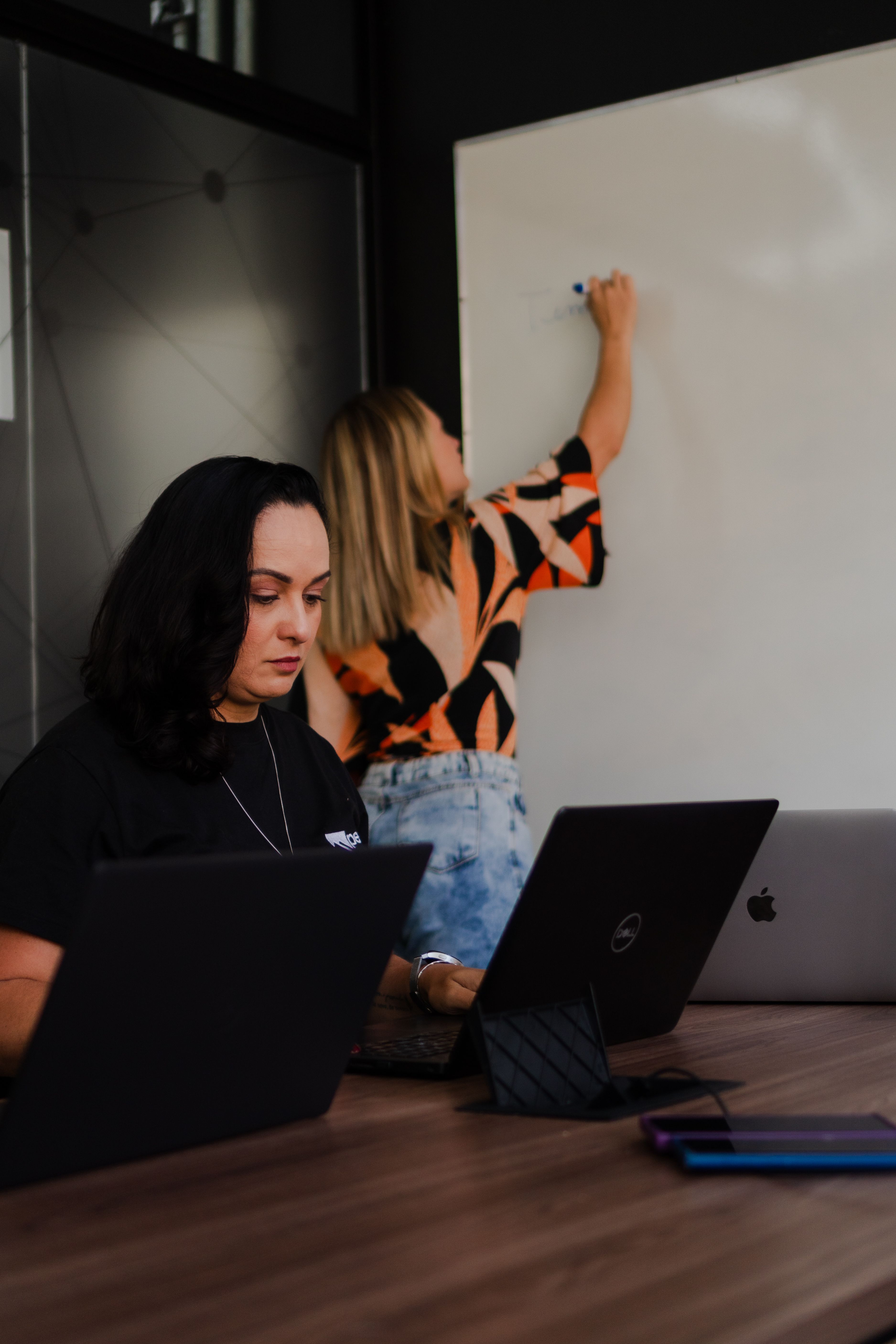 Strategy session — team at whiteboard and laptops